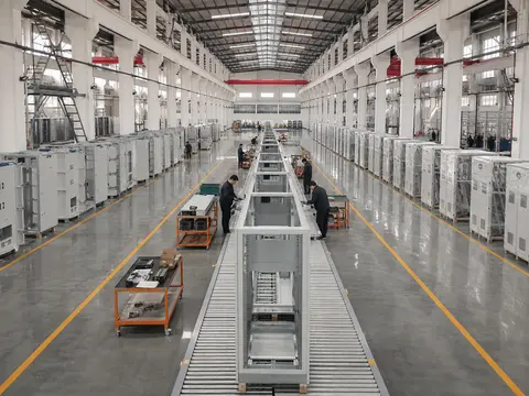 Main assembly hall — conveyor line and finished units awaiting dispatch